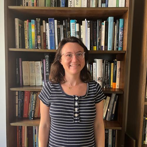 Photo of Courtney Cooperman against a bookcase