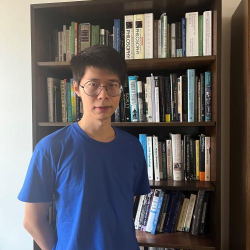 Picture of Xianghan against a bookcase