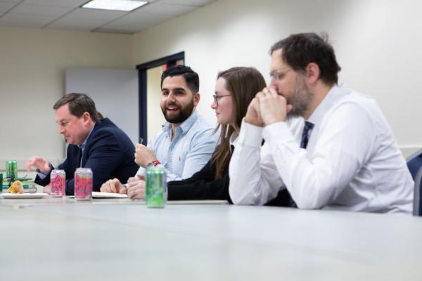 Philosophy majors, minors and alumni sit at a table at a February 2020 career planning event.