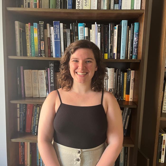 Angela King against a bookcase