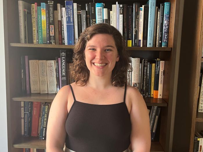 Angela King against a bookcase