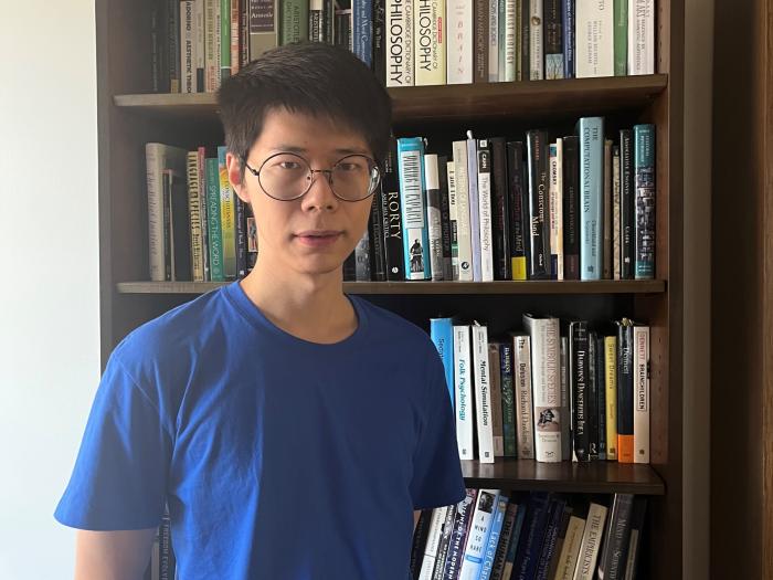 Picture of Xianghan against a bookcase